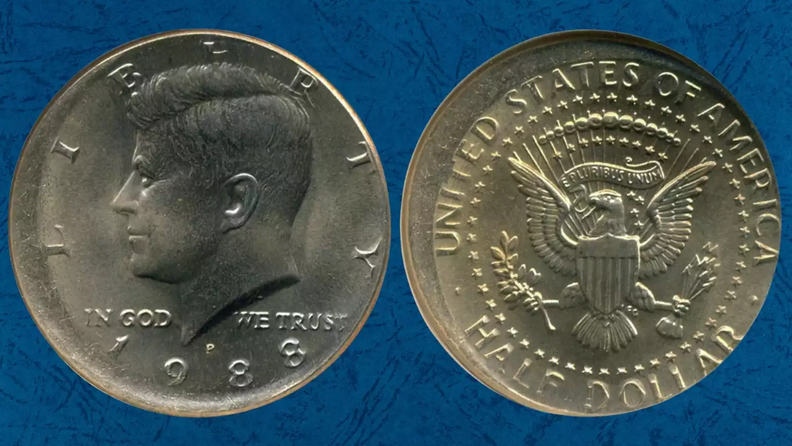 1988 Kennedy half dollar with off-center strike error showing partial design impression and exposed blank planchet area