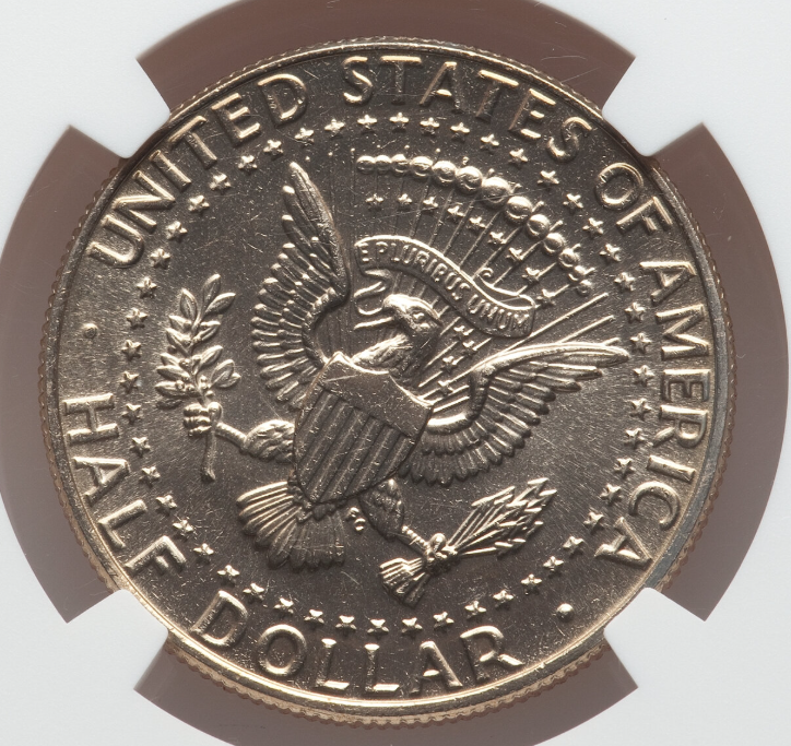 1988 Kennedy half dollar rotated die error showing the reverse eagle design significantly rotated from normal coin alignment